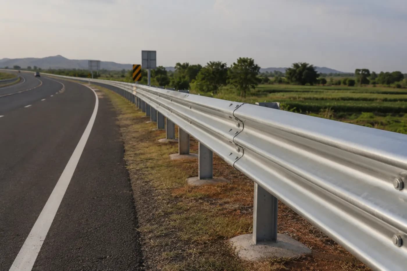 Thrie Beam Crash Barrier Manufacturers — manufactured by YNM Safety, road marking and road safety products